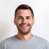 Closeup male studio portrait of happy man looking at the camera.- Image