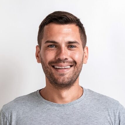 Closeup male studio portrait of happy man looking at the camera.- Image